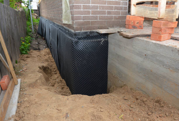 SJ Waterproofing Pros technician performing targeted Exterior Waterproofing assessment in Delton, MI